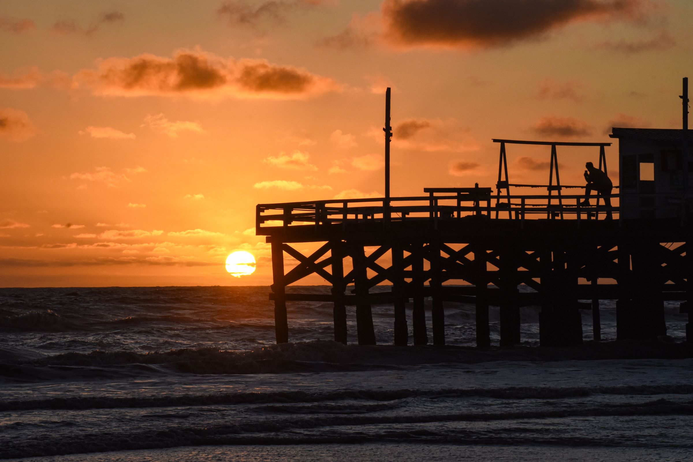 Golden-hour pier over the Space Coast